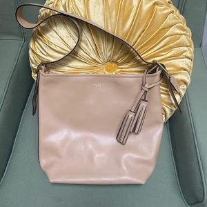 Beautiful tan leather coach purse bucket style